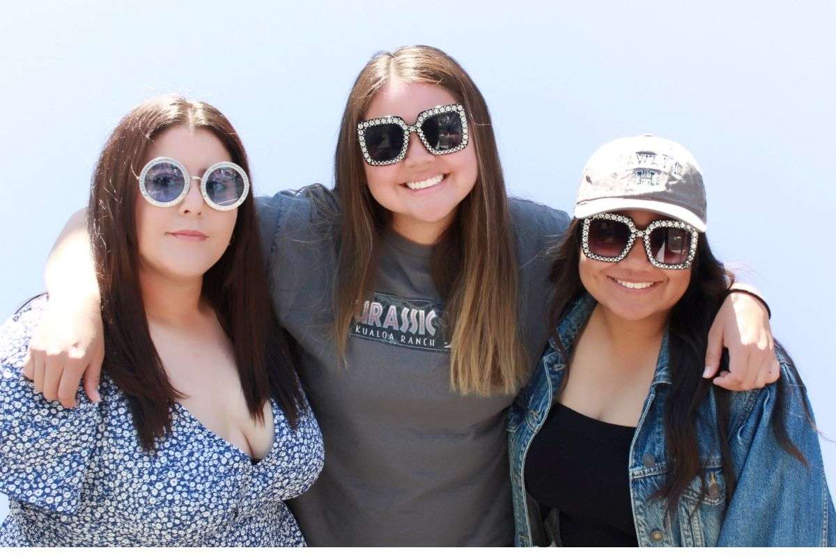 Guests posing at a corporate event photo booth